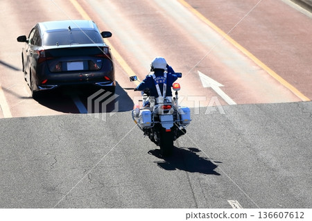 Image of a police motorcycle on patrol Image of a police motorcycle on patrol 136607612