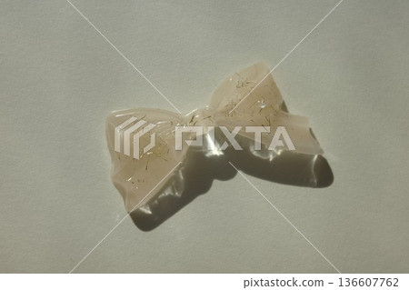 Ribbon-shaped resin accessory parts and shadows Ribbon-shaped resin accessory parts and shadows 136607762