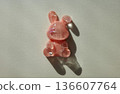 Pink rabbit resin figure with long shadow 136607764