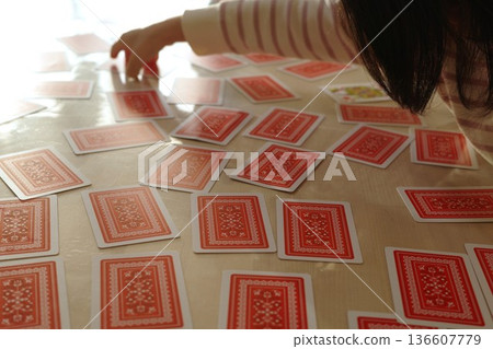 A child choosing a card in a game of concentration A child choosing a card in a game of concentration 136607779