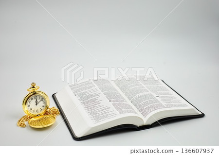 Black Leather Holy Bible With Golden Pocket Watch Grey Background Black Leather Holy Bible With Golden Pocket Watch Grey Background 136607937