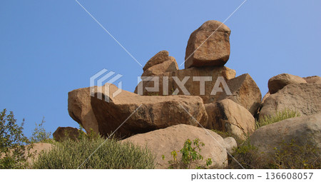 Unique shaped big granite boulders in Sanapur, village near Hampi, India. Unique shaped big granite boulders in Sanapur, village near Hampi, India. 136608057