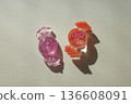 Candy-shaped resin parts and shadows 136608091