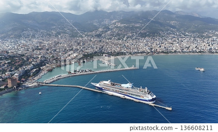 Cruise ship docks in resort town. picturesque seaport Cruise ship docks in resort town. picturesque seaport 136608211