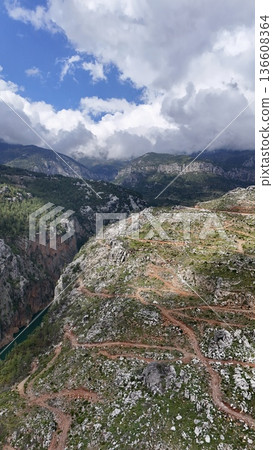 Mountainous winding road. mountain landscape view from above Mountainous winding road. mountain landscape view from above 136608364