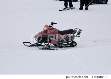 Snowy snowmobile solitude. High quality photo 136608388