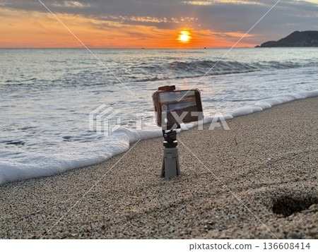 Shooting on the beach at sunset. High quality photo Shooting on the beach at sunset. High quality photo 136608414