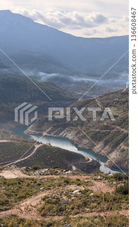 Mountainous landscape path. Mountain road forest. coniferous trees and yellow foliage. High quality 4k footage Mountainous landscape path. Mountain road forest. coniferous trees and yellow foliage. High quality 4k footage 136608467