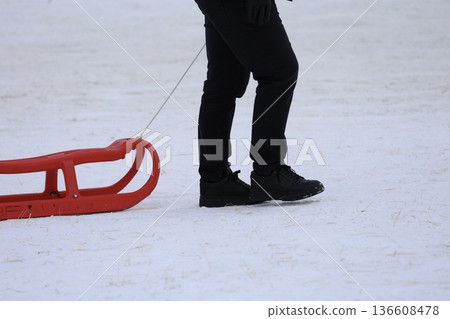 Person pulling sled. High quality photo 136608478