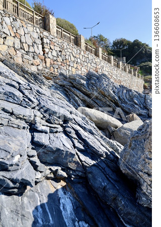 Rocky coastal wall. High quality photo Rocky coastal wall. High quality photo 136608653