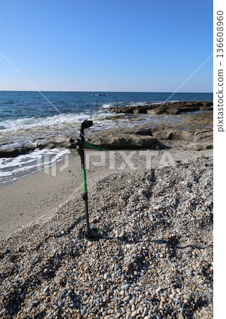 Beach metal detecting. High quality photo Beach metal detecting. High quality photo 136608960