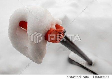 Snow on a shovel 136609664