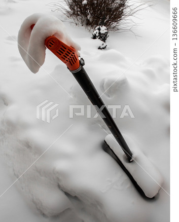 Snow on a shovel Snow on a shovel 136609666
