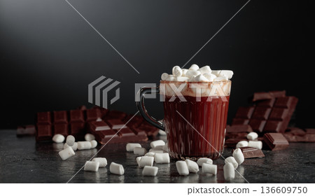 Hot chocolate with mini marshmallow in a glass mug. 136609750
