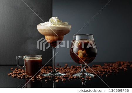 Black coffee and iced coffee cocktails on a black reflective background. 136609766