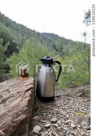 Flask tea outdoors. High quality photo Flask tea outdoors. High quality photo 136610320