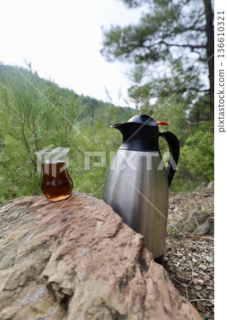 Flask tea outdoors. High quality photo Flask tea outdoors. High quality photo 136610321