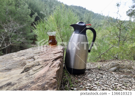 Flask tea outdoors. High quality photo Flask tea outdoors. High quality photo 136610323