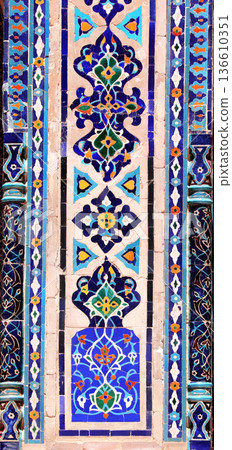 Vertical background with detail of ancient mosaic walls with floral and geometric ornament. Traditional tile decoration on wall, Samarkand, Uzbekistan 136610351