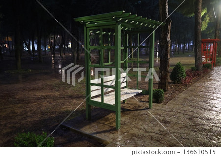 Green bench rain. High quality photo Green bench rain. High quality photo 136610515