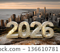 Decorative 2026 numbers on rocky ledge overlooking city skyline 136610781