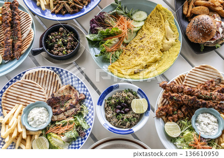 many different mediterranean food dishes on restaurant table in greece many different mediterranean food dishes on restaurant table in greece 136610950