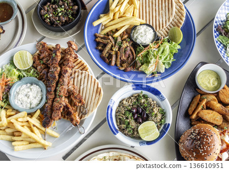 many different mediterranean food dishes on restaurant table in greece many different mediterranean food dishes on restaurant table in greece 136610951