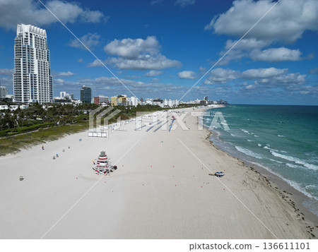 Miami south beach. Travel to sea. Aerial top view of sand beach with turquoise water. Luxury resort. Enjoying beach sun. Summer vacation. Beach vacation at sea in summer. Sea relax at seashore 136611101