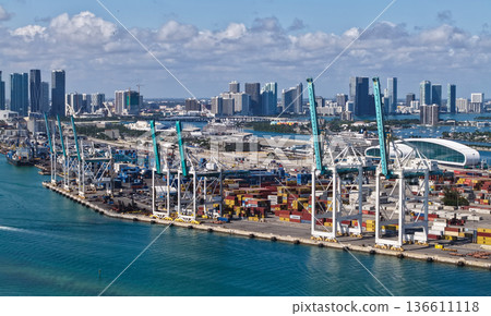Miami, Florida - February 04, 2025: Port of Miami. Container port. Export and import. Cargo industrial business. Cargo services with container in Miami port, aerial view. Freight container of cargo 136611118