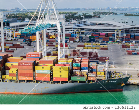 Miami, Florida - February 12, 2025: Export and import. Port of Miami. Cargo ship loaded with container in Miami, aerial. Freight container. Aerial Miami port with cargo container. Cargo handling Miami, Florida - February 12, 2025: Export and import. Port of Miami. Cargo ship loaded with container in Miami, aerial. Freight container. Aerial Miami port with cargo container. Cargo handling 136611122