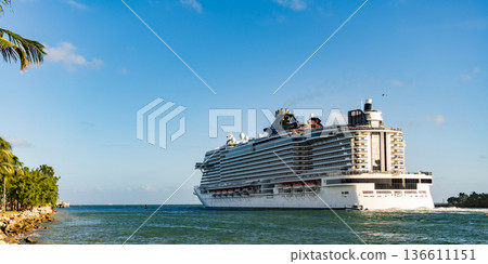 Cruise ship voyage. Majestic view of cruise in summer vacation. Cruise ship tour and travel at sea. Trip on luxury liner voyage. Ship leaving Miami beach port. Miami tour 136611151
