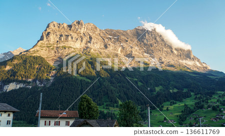 The north face of the Eiger, a famous peak in the Swiss Alps, with its rock surface shining golden in the evening light. The north face of the Eiger, a famous peak in the Swiss Alps, with its rock surface shining golden in the evening light. 136611769