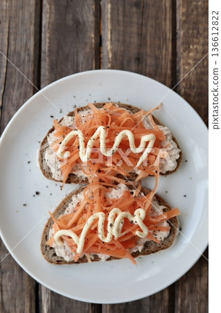 Tuna and carrot open sandwich made with Berliner Landbrot, a German rye bread Tuna and carrot open sandwich made with Berliner Landbrot, a German rye bread 136612822