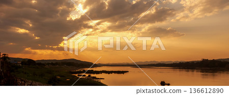 Banner Golden sky sunrise dramatic beautiful landscape view. Dawn sky gold dusk time cloudscape with sunlight. Panorama Dramatic sunset scenic landscape. Beautiful landscape nature with copy space Banner Golden sky sunrise dramatic beautiful landscape view. Dawn sky gold dusk time cloudscape with sunlight. Panorama Dramatic sunset scenic landscape. Beautiful landscape nature with copy space 136612890