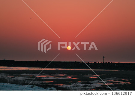 The red sunset in Hamaatsuma, Hokkaido, on the Pacific Ocean The red sunset in Hamaatsuma, Hokkaido, on the Pacific Ocean 136612917