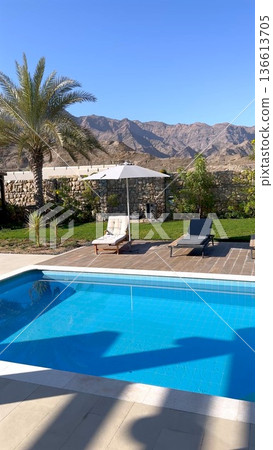 Luxurious Outdoor Escape Featuring Scenic Views And Calm Poolside Area. Exclusive Openair Retreat Showcasing Picturesque Landscapes And Serene Swimming Environment 136613705