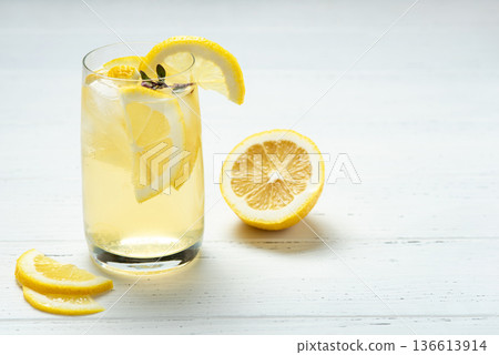 Homemade lemonade with lemon on a white background Homemade lemonade with lemon on a white background 136613914