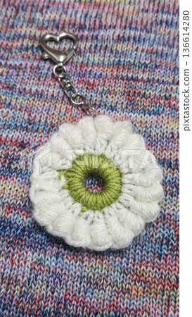 Knitted flowers and circles suitable for home decor, fashion, or textiles. 136614280