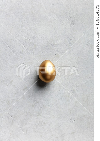 Minimal Luxury Easter Concept with Single Golden Egg Minimal Luxury Easter Concept with Single Golden Egg 136614375