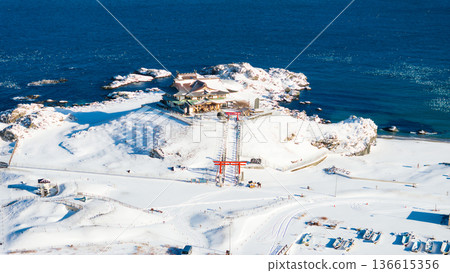 Aerial view of snow-capped Kabushima in Aomori Prefecture, Hachinohe City 136615356