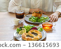 A woman eating breakfast　 136615693