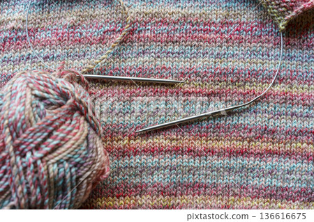 Cozy Handmade Knitting Scene with Colorful Wool Yarn Balls and Wooden Needles 136616675