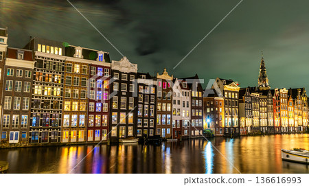 Amsterdam city at night. Old water canal houses in Netherlands 136616993
