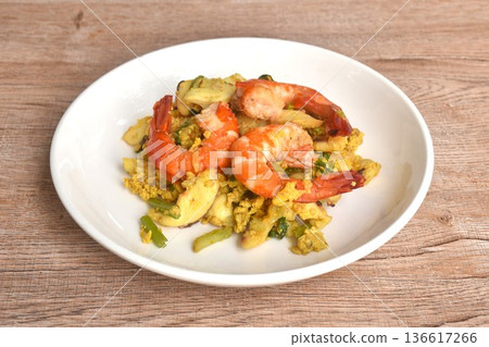 stir fried shrimp and squid in yellow curry couple egg on plate stir fried shrimp and squid in yellow curry couple egg on plate 136617266