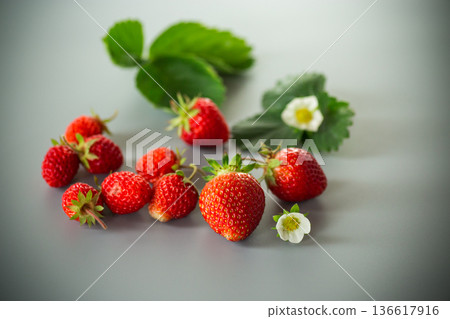 Appetizing red strawberries in a minimalistic composition 136617916