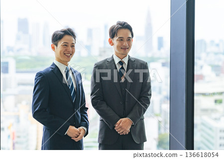 Group of business people standing in a lobby 136618054