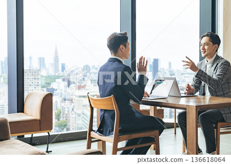 Group of casual business people meeting in an office Group of casual business people meeting in an office 136618064