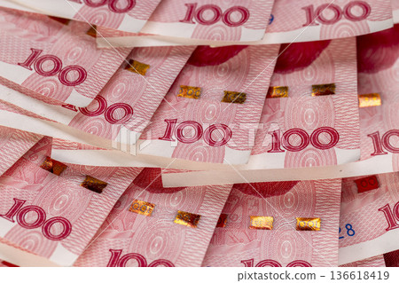 Chinese cash in denominations of one hundred yuan, heap of paper Chinese money in denominations of 100 yuan Chinese cash in denominations of one hundred yuan, heap of paper Chinese money in denominations of 100 yuan 136618419