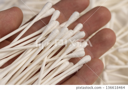 cotton swabs with natural cotton for hygiene and cosmetics, white natural sticks with natural white cotton for makeup correction , injury treatment 136618464