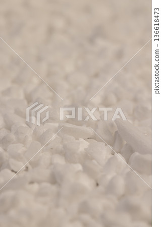 white coarse solid salt that is used in dishwashers to improve and soften water, coarse crystals of special salt for dishwashers for good and long-lasting dishwasher operation white coarse solid salt that is used in dishwashers to improve and soften water, coarse crystals of special salt for dishwashers for good and long-lasting dishwasher operation 136618473